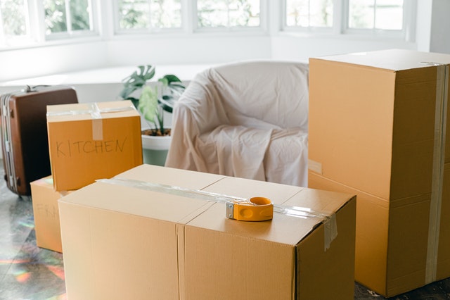 boxes packed for an estate clearing and move with unpacking after the move